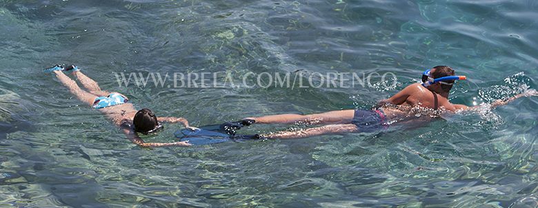 Children swimming in clear Adriatic sea