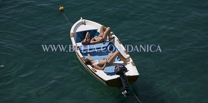 girsl sunning on the boat