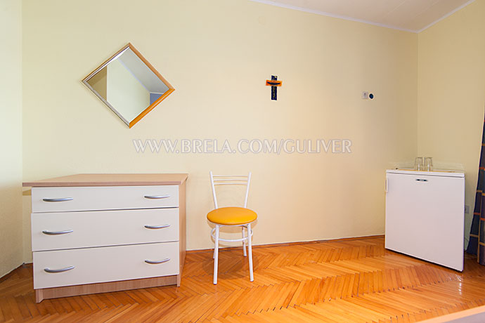 dressing mirror, chair, refrigerator