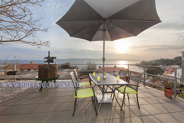 apartments Intrada, Brela - terrace on sunset, view on Brela beach