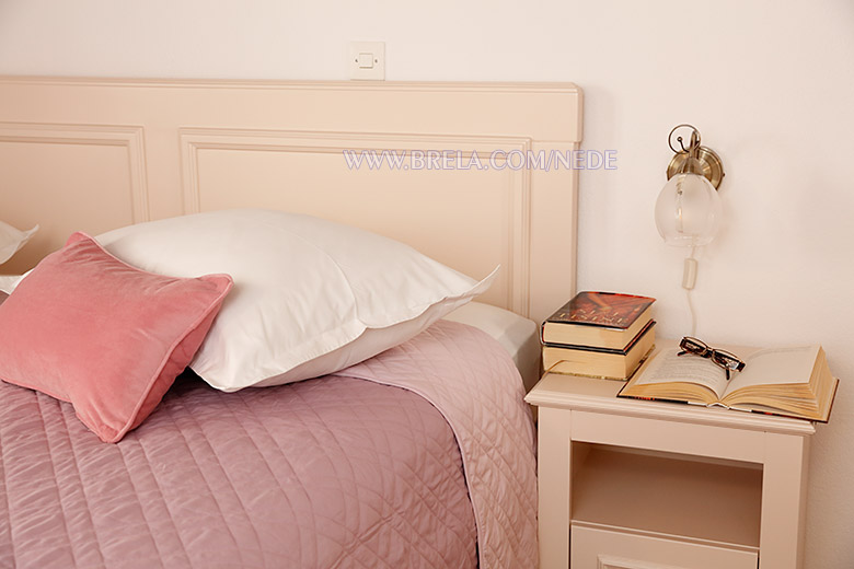books on night stand - apartments Nede, Brela